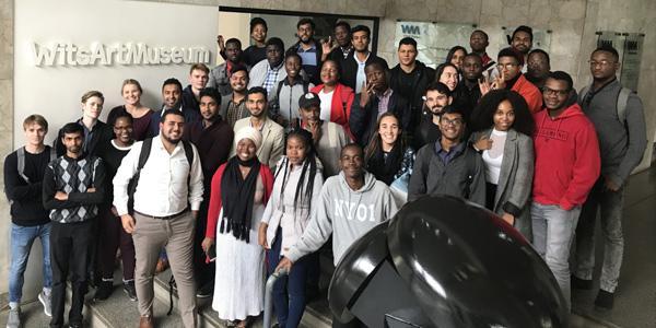 Engineering lecturer Bontle Tladi in middle with black scarf uses the collection at Wits Art Museum to teach engineering